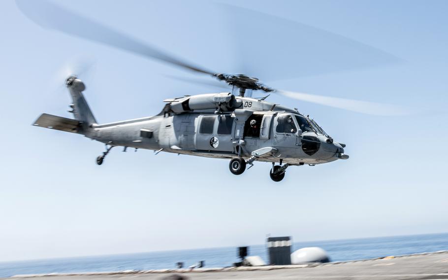 An MH-60S Seahawk Helicopter takes off from the aircraft carrier USS George Washington while underway in the Pacific Ocean, Aug. 25, 2024. 