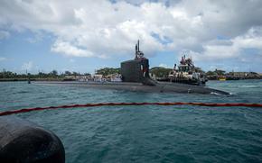 The Virginia-class fast-attack submarine USS Minnesota arrives at Naval Base Guam on Nov. 26, 2024.