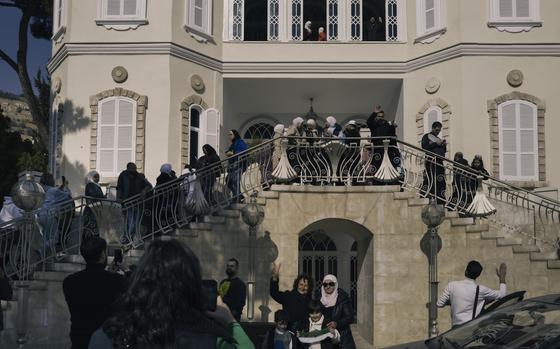 Civilians gather at Asma al-Assad's palace in Damascus, Syria, on Monday after it was looted. MUST CREDIT: Lorenzo Tugnoli for The Washington Post