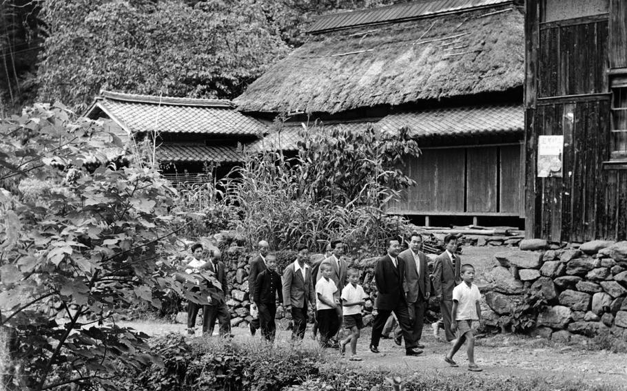 Rep. Daniel K. Inouye (D-Hawaii) visited the mountain village of Yokoyama – the birthplace of his father and where some of his uncles and cousins still live, Oct. 2, 1960. The Hawaiian congressman met many of the 2,200 villagers of Yokoyama – some 400 of whom are named Inouye. Several relatives and some villagers joined the Congressman for a stroll through the village.