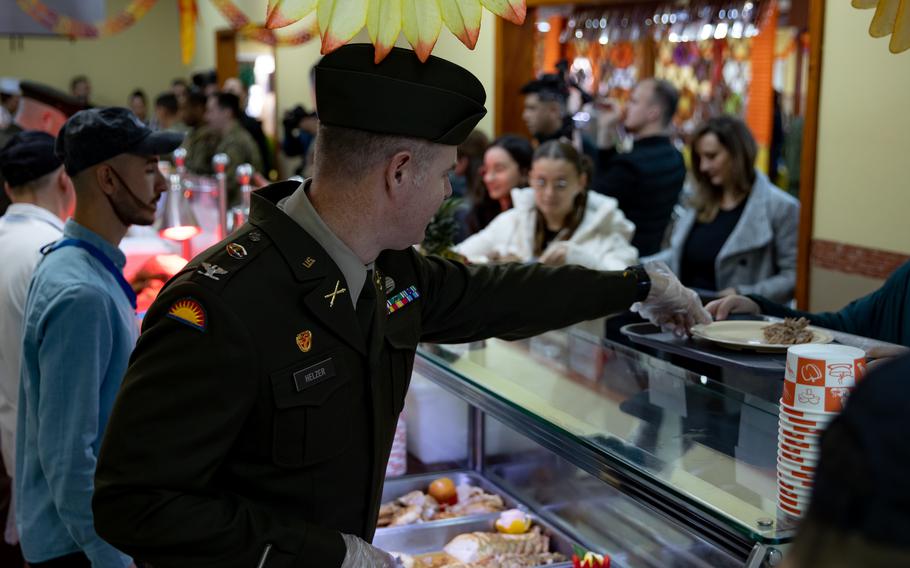 Multinational forces and distinguished guests celebrate Thanksgiving with a feast