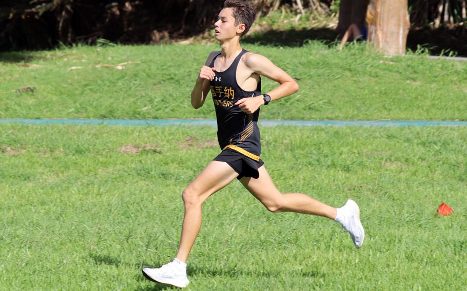 Kadena’s William Rhoades sprints toward the finish of Saturday’s Okinawa boys cross country race at Cape Zampa. Rhoades won with a time of 17 minutes, 44.47 seconds.