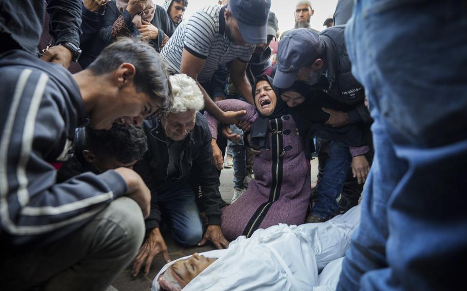 Palestinians wail after their relatives are killed in the Israeli bombardment.