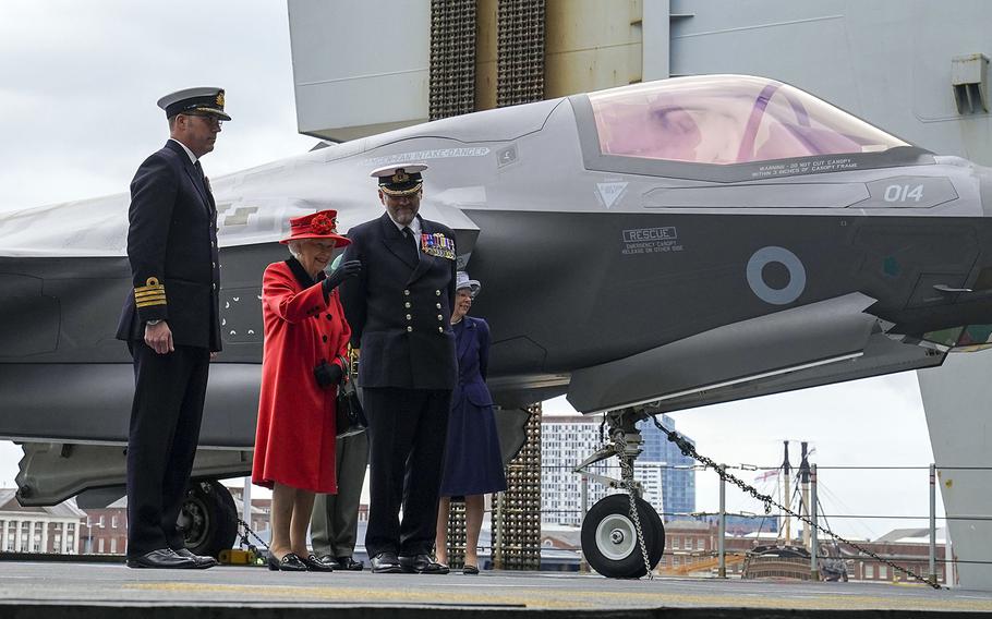 stripes - Queen Elizabeth II visits carrier ahead of its ...