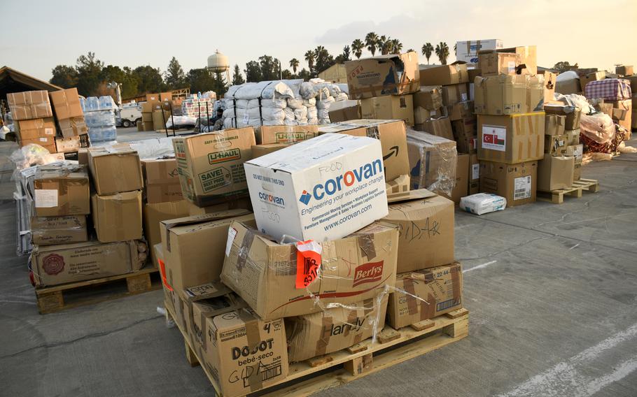 Boxes of humanitarian aid at Incirlik Air Base, Turkey, await pickup on Feb. 22, 2023, for transport to survivors of the earthquakes that have devastated the region. Labels on the boxes indicated they contained items such as tents, generators and food, with origins ranging from San Antonio, Texas, to Shenzhen, China.
