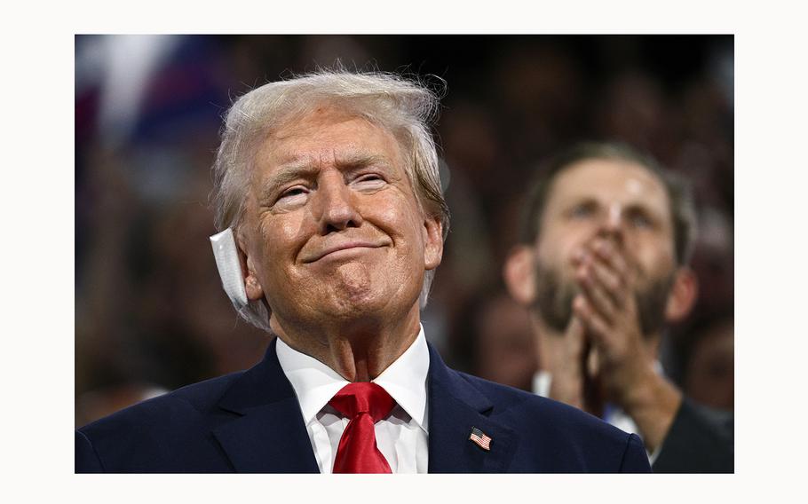 Former President and 2024 Republican presidential candidate Donald Trump, a bandage on his ear after being wounded in an assassination attempt, attends the first day of the 2024 Republican National Convention at the Fiserv Forum in Milwaukee, Wisconsin, July 15, 2024. 