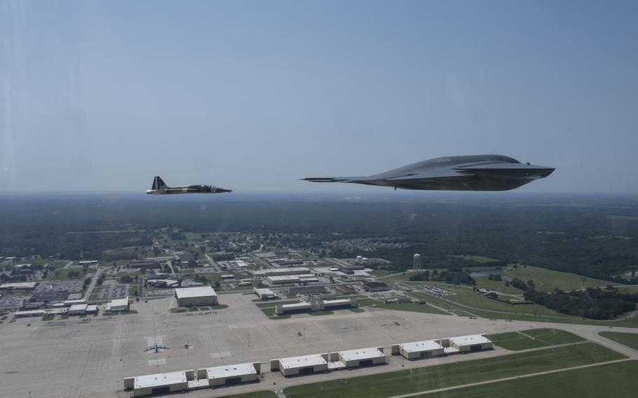 A U.S. Air Force B-2 Spirit stealth bomber and a T-38 Talon aircraft assigned to the 509th Bomb Wing conduct a flyover during the 2024 Wings Over Whiteman Air Show at Whiteman Air Force Base, Mo., July 13, 2024.