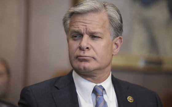 FBI Director Christopher Wray listens during a meeting of the Justice Department's Election Threats Task Force at the Department of Justice, Wednesday, Sept. 4, 2024, in Washington. (AP Photo/Mark Schiefelbein)