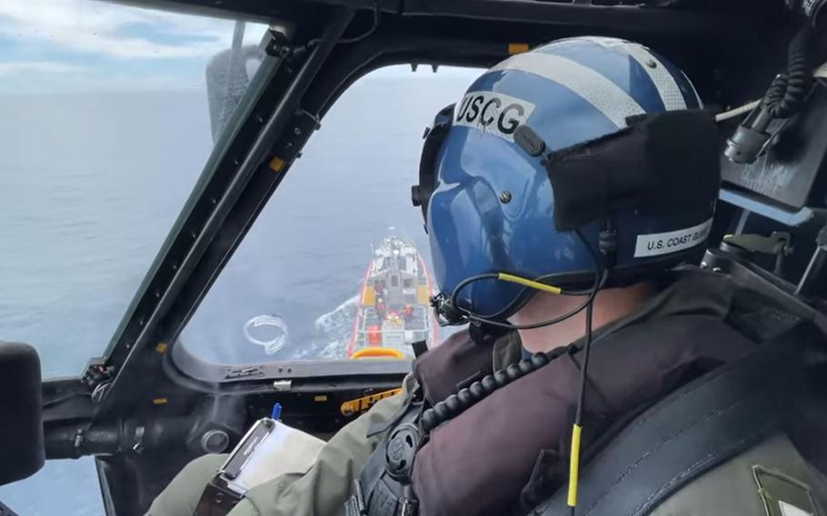 A Coast Guard helicopter from the Clearwater air station flies a rescue mission on July 1, 2021.