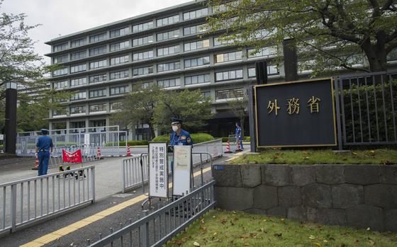 FILE - This photo shows an exterior view of Japan's foreign ministry building with its sign at the main entrance in Tokyo, Sept. 17, 2021. (AP Photo/Hiro Komae, File)