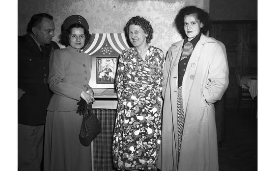 HED: U.S. Army nurses - and survivors of the Bataan Death March - at the march's survivors reunion, 1949

Darmstadt, Germany, April 8, 1949: Most likely three former Army nurses, Mrs. Eileen Francis, Mrs. Carmen Sewell, and 1st Lt. Eleanor M. Garen, all survivors of the Bataan Death March and imprisonment by the Japanese army during WWII. On the left is possibly Mrs. Eileen Francis' husband, Maj. Garnet P. Francis, also a survivor of the march.

The march forced some 93,000 Filipino and 12,000 American prisoners of war to march through the Philippines a route of about 65 miles enduring tropical heat, humidity and rain, without adequate food or medical care. Those unable to make it through the march were beaten, killed and sometimes beheaded by their Japanese guards. 

Do you know any of the people in this photograph? Please get in touch with our archivist Catharine Giordano via email giordano.catharine@stripes.com as she is trying to correctly identify those in attendance at the second annual Bataan Death March reunion held April 8-9, 1949 in Darmstadt, Germany. 

The 1949 original negative suffers from a preservation issue called "silvering," where the silver particles rise to the top of the gelatin layer of the film. During a preservation survey of Stripes' photo collection in 2018, archives staff found the 4x5 negatives from the late 1940s and early 1950s to be suffering the most from this preservation issue. As the "silvering" will eventually cause the image captured on the negative to fade, the affected negatives were pulled and prioritized for scanning. 

Read the 1949 article by Brig. Gen. Clinton A. Pierce - veteran of Bataan and survivor of the Bataan Death March, as well as see additional photos of second annual reunion here. 

META DATA: Europe; World War II; WW2; Pacific; Bataan Death March; Battle of Bataan; Japanese Army; Philippines; prisoners of war; POW; U.S. Army; nurses