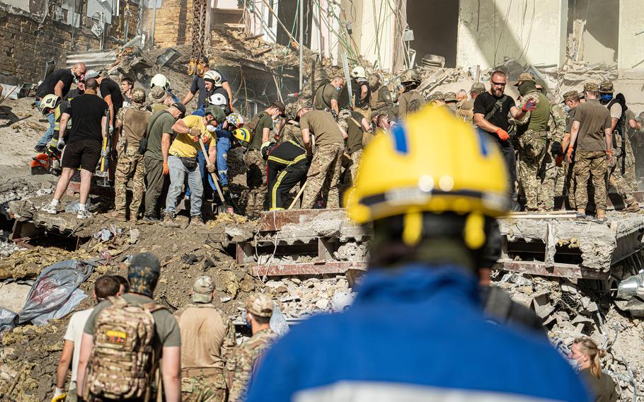 Rescue and military forces clear the rubble of the destroyed building of Ohmatdyt Children's Hospital following a missile strike in Kyiv capital of Ukraine on July 8, 2024. Russia launched more than 40 missiles at several cities across Ukraine in an attack that killed at least 33 people. 