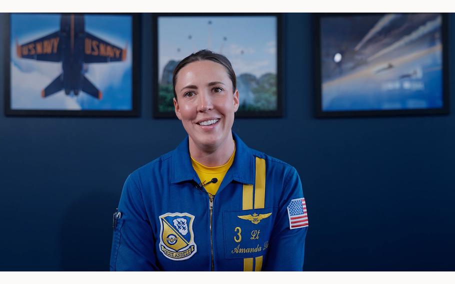 A video screen grab shows Lt. Cmdr. Amanda Lee, the first female Blue Angels F/A-18 Super Hornet demonstration pilot.