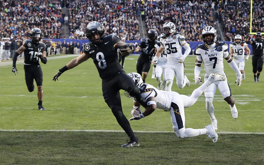 Army’s Hayden Reed avoids a tackle and into the end zone.