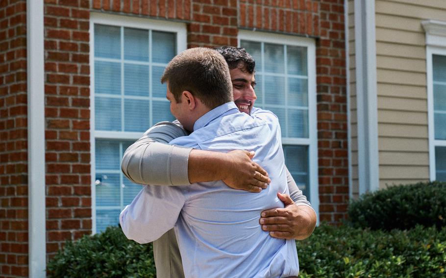 U.S. Army veteran Sean Halpin greets Esmatullah, a former liaison officer with the Afghan defense ministry whom he met in Kabul in 2019 and helped flee that country.