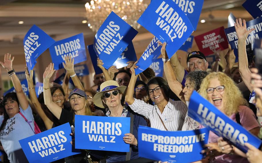 Attendees cheer as speakers arrive at an event kicking off a national “Reproductive Freedom Bus Tour” by the campaign of Democratic presidential nominee Vice President Kamala Harris and running mate Gov. Tim Walz, Tuesday, Sept. 3, 2024, in Boynton Beach, Fla. 