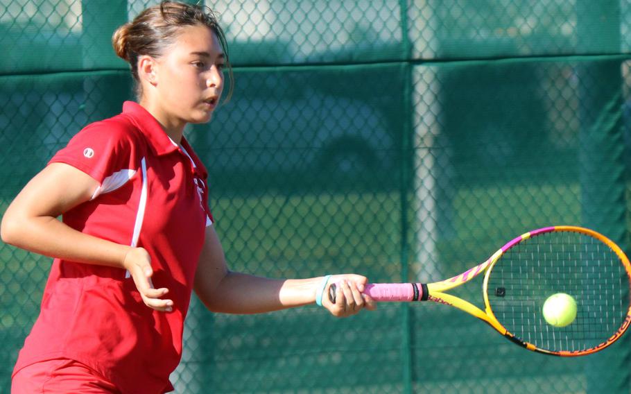 Nile C. Kinnick's Kikyo Deeter returns the ball during Tuesday's Kanto Plain tennis matches. Deeter and doubles partner Lisa Galloway lost to American School In Japan's Yume Rivon-Matsushita and Koko Watanabe  8-4.