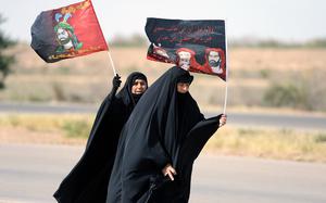 Baghdad, Iraq, Apr. 22, 2015: Two Shiite women walk along a highway during a pilgrimage from Baghdad to shrines in the city of Samarra, April 22, 2015. Later that day a suicide car bomb went off next to a crowd of pilgrims as they were returning from Samarra, killing eight and wounding 16. At this time, suicide bombings were a nearly daily occurance for millions of Iraqis.

Stars and Stripes reporter and photographer Josh Smith wrote about life amidst the ever present violence in Iraqi's capital in this 2015 article. 

https://www.stripes.com/theaters/middle_east/bombings-and-islamic-state-don-t-define-life-for-most-in-baghdad-1.344258

META TAGS: Operation Enduring Resolve; Iraq; Wars on Terror; suicide bombings; Iraqis; 