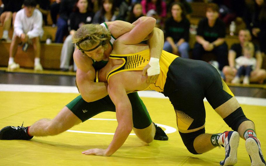 Kubasaki 172-pounder Kaiser Armour gains the advantage over Kadena’s Ryder Livingston during Wednesday’s Okinawa wrestling dual meet. Armour pinned Livingston in 58 seconds, but the Panthers won the meet 40-23, improving to 3-0 over the Dragons this season.