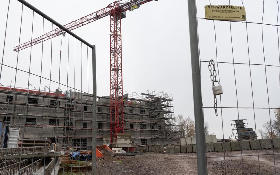 A crane stands over a fenced construction site in Baumholder.