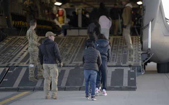 U.S. Customs and Border Protection security agents guide a group of illegal aliens onboard a C-17 Globemaster III aircraft assigned to the 60th Air Mobility Wing for a removal flight at Fort Bliss, Texas, on Jan. 23, 2025. Under the direction of U.S. Northern Command, U.S. Transportation Command is supporting Immigration and Customs Enforcement removal flights by providing military airlift. (Dept. of Defense photo by U.S. Army Sgt. 1st Class Nicholas J. De La Pena)