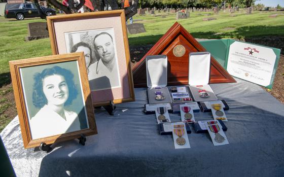 Framed family photos, Military Awards and tributes rest on a remembrance table for U.S. Army Private Billy E. Calkins at the Fir Lawn Memorial Cemetery, Hillsboro, Oregon on Sept. 13, 2024. Calkins remains were return to Oregon 82 years after his death in the Philippines where he served with the 31st Infantry Regiment, Company B, and died at the Cabanatuan Prison Camp on Nov. 1, 1942 when he as 17 years old. (National Guard photo by John Hughel, Oregon Military Department Public Affairs)