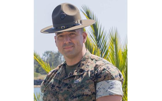 U.S. Marine Corps Lt. Col. Mark M. Phelps, the commanding officer of 3rd Recruit Training Battalion, left, Staff Sgt. Francisco J. Rosario, a senior drill instructor with 3rd Recruit Training Battalion, middle, Sgt. Maj. Gerardo E. Trevino, the sergeant major of 3rd Recruit Training Battalion, right, and spouses, pose for a group photo during a volunteer appreciation event at Marine Corps Recruit Depot San Diego, California, April 30, 2024. The event was held to show appreciation for the Marines, Sailors, and civilians that assisted with volunteer events across the Depot and the local communities. (U.S. Marine Corps photo by Lance Cpl. Janell B. Alvarez)