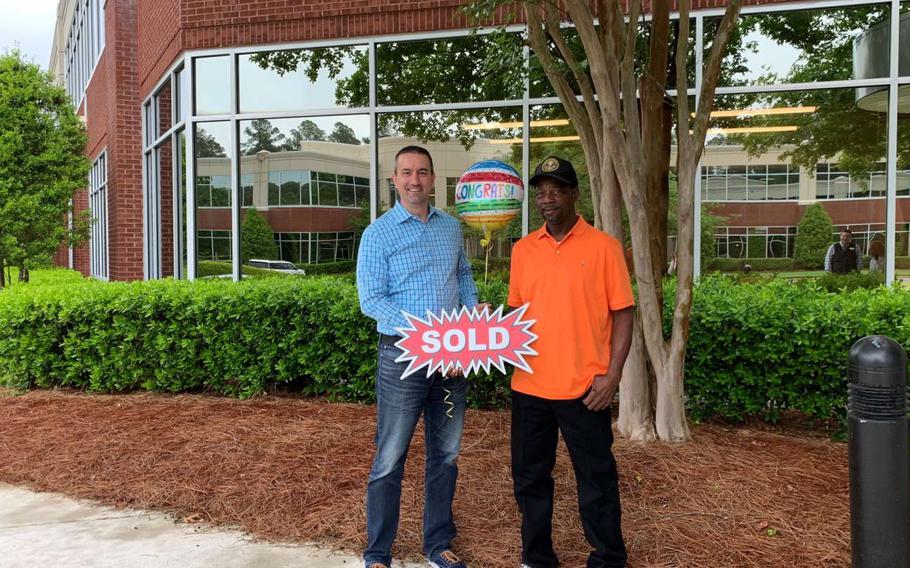 Raleigh Area Land Trust Executive Director Rhett Fussell (left) and James Watson. Army veteran Watson is the first owner to buy a home though RALT. The trust’s aim is to increase affordable housing options for low-income workers. The blueprint: a community land trust, or shared equity model.