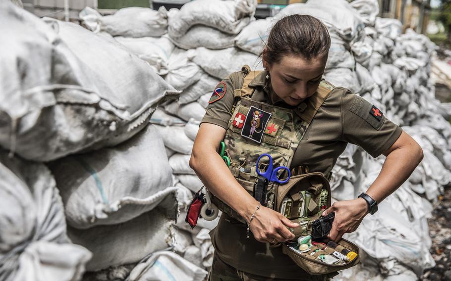 Hanna Khurava wears her bulletproof outside a hospital in Kramatorsk on June 30, 2022.