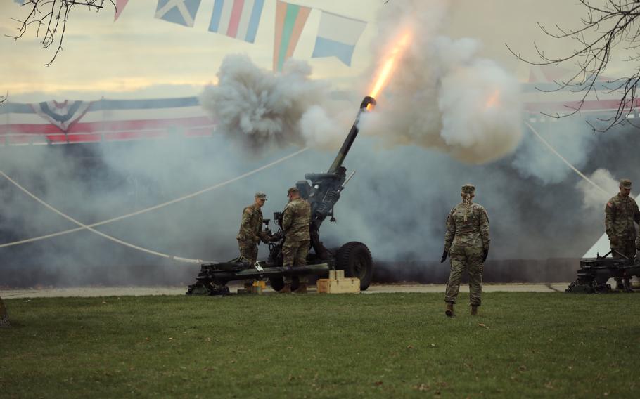 Soldiers with the Wisconsin National Guard fire from a battery of M119A3 howitzers to salute the USS Beloit, Nov. 23, 2024.