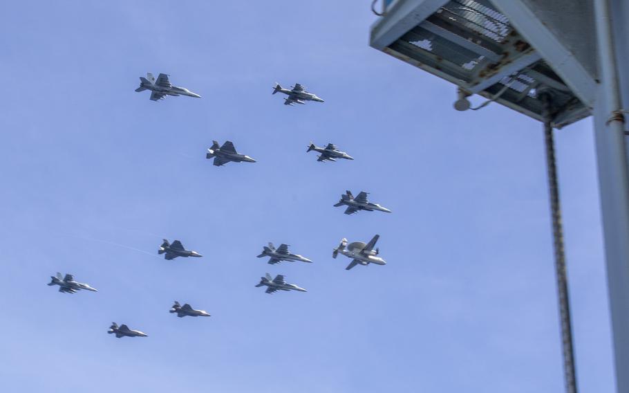 U.S. and Italian navy aircraft fly in formation over the Pacific Ocean, Aug. 9, 2024. C