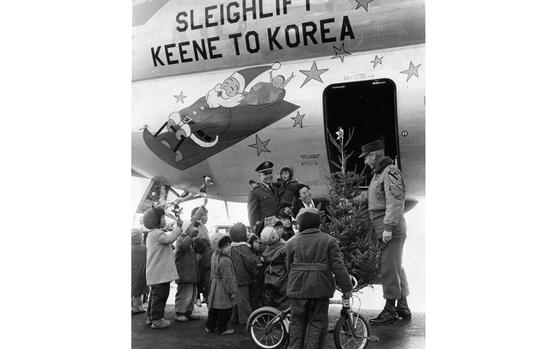 HED: Santa's big sleigh, 1960: 


Seoul, South Korea, Dec. 10, 1960: Children from the Pubwon Orphanage near Seoul greet the "Christmas Sleigh" - the C-97 Stratofreighter of the New Hampshire Air National Guard - at Kimpo Air Base, in Seoul. 

The plane carried six tons of toys, shoes, canned milk, school desks, medical supplies and other items, including the 7-foot Christmas tree, all destined for the orphanage. The goods were donated by the citizens of Keene, New Hampshire in response to a plea from 1st Lt. Horace D. Verry (in the back, holding one of the orphans), assigned to the 27th Ordnance Battalion, 1st Cavalry Division and the orphanage's project director. 

Verry wrote a letter to his hometown paper in Keene asking for donations. Brig. Gen. Frank H. Britton, commanding general of the 1st Cavalry, was on hand to gift the Christmas tree to Ms. Ou Soon Lee, head of the orphanage. 

Looking for Stars and Stripes’ historic coverage? Subscribe to Stars and Stripes’ historic newspaper archive! We have digitized our 1948-1999 European and Pacific editions, as well as several of our WWII editions and made them available online through https://starsandstripes.newspaperarchive.com/

META TAGS: U.S. Air National Guard; Operation Orphan; holidays; Christmas; philanthropy; charity; Koreans; children; donation; military life