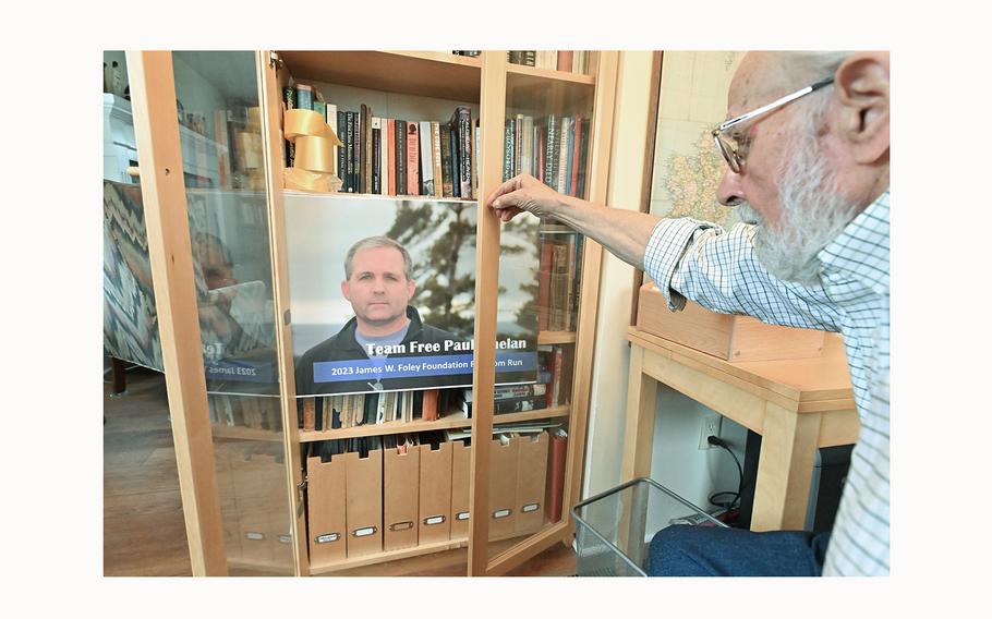 Ed Whelan at his home in Manchester, Michigan on Dec. 30, 2023, shows a poster of his incarcerated son Paul Whelan, who has been detained for 5 years in a Russian penal colony.