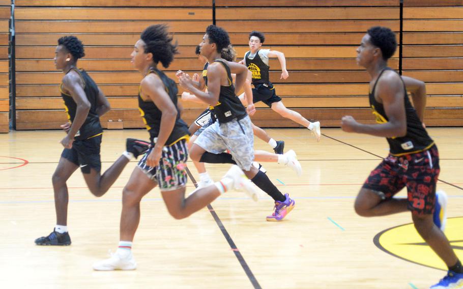 Kadena players run sprints in basketball practice.