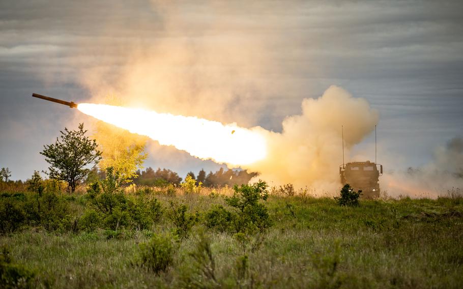 U.S. soldiers assigned to the 41st Field Artillery Brigade  engage targets with a pair of high mobility artillery rocket systems, or HIMARS, during an exercise in Bemowo Piskie, Poland, in May 2023. The reelection of Donald Trump as president will likely mean changes to the U.S. military’s mission in Europe.