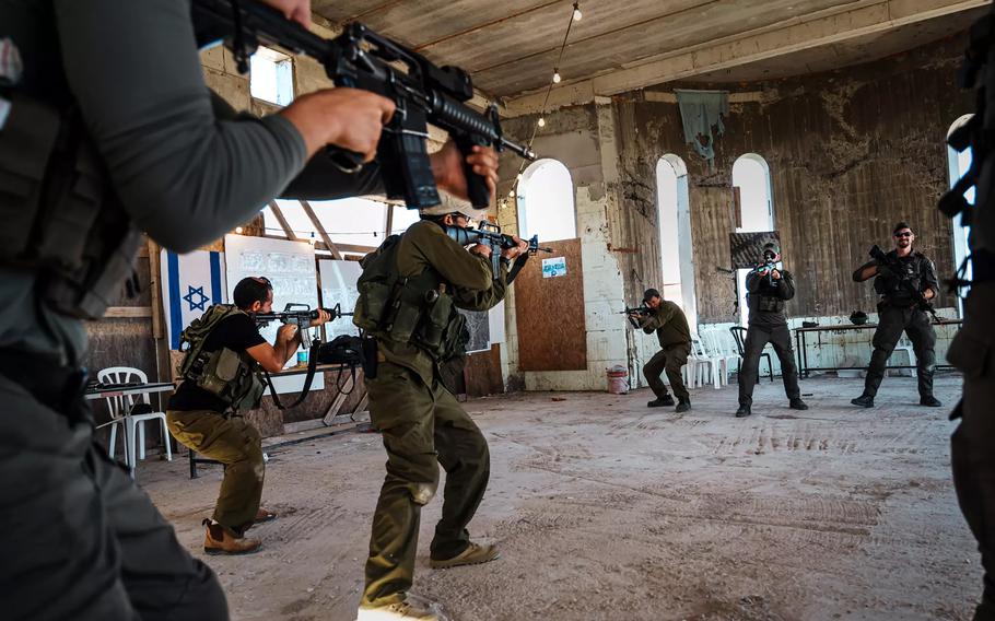 Reservist soldiers, settlers and volunteers train in the Israeli settlement of Mitzpe Yair in the West Bank.