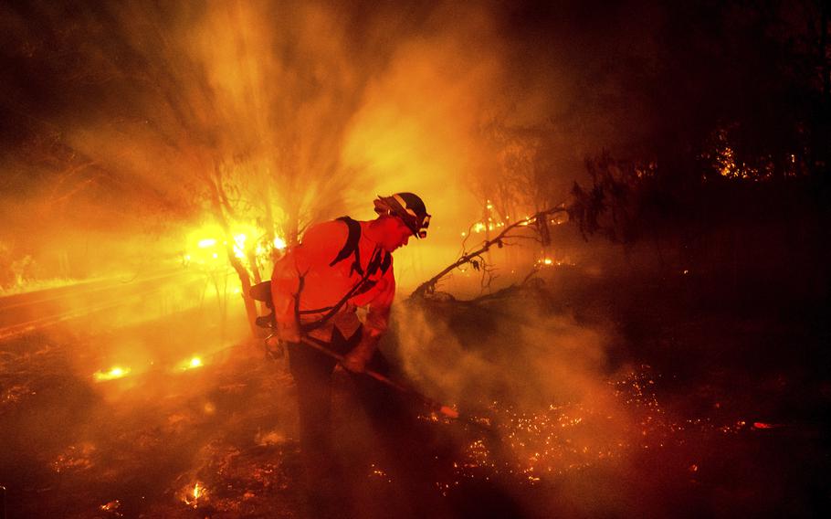 Firefighter Chris Fritz works to keep the Aero Fire from spreading through the Copperopolis community of Calaveras County, Calif., on Monday, June 17, 2024.