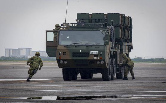 Japan Ground Self-Defense Force Soldiers Simulate The Use Of A Type 12 ...