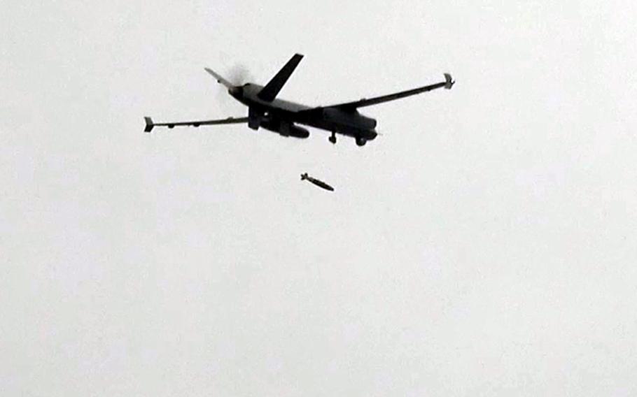 A U.S. Air Force MQ-9 Reaper drops an inert munition over Jikdo Island in South Korea.