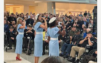 The singing group Victory Belles from the National Museum of World War II perform before veterans preparing to travel  from Dallas to France with American Airlines to attend D-Day commemorations in Normandy. 
