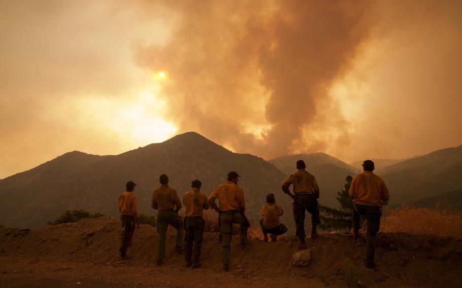 Flames and smoke in the distance in Angelus Oaks, Calif.