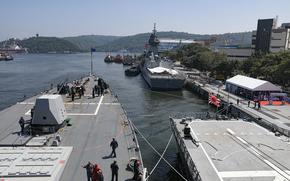 USS Dewey in port along with allied ships.