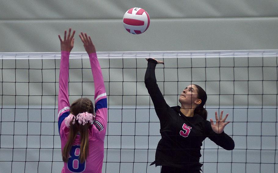 Emaline Overton spikes the ball.