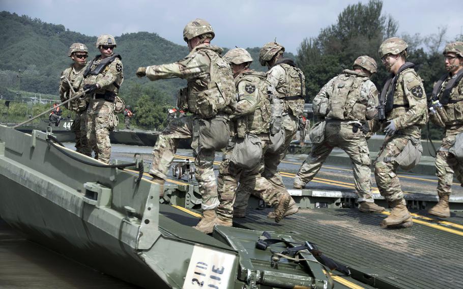 Soldiers from 11th Engineer Battalion, 2nd Infantry Division connect ribbon bridges during a wet-gap crossing drill near the North Korean border, Aug. 31, 2023.