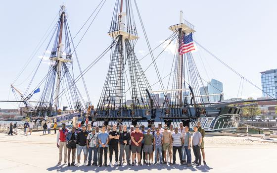 Students and faculty pose for a group photo in front of the USS Constitution during the 72nd International Maritime Officer Course Sept 8, 2024, at Boston, Massachusetts. Twenty-seven students from 23 countries attended the 12-week course, based in Yorktown, Virginia, which aimed to teach them how the USCG operates and to provide insight into the history and culture of the United States. (U.S. Coast Guard photo by Bryan Myhr)