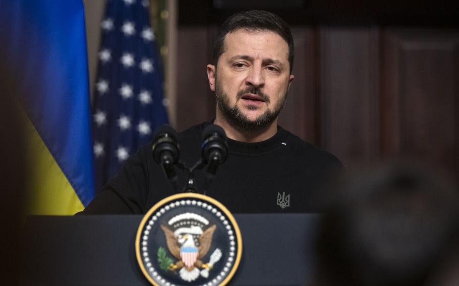 Ukrainian President Volodymyr Zelensky addresses reporters at a news conference in Washington in December 2023.