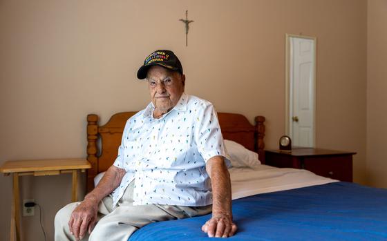 World War II veteran Eugene Russo, who turns 100 this month, at his home in Lawrenceville. (Arvin Temkar / AJC)