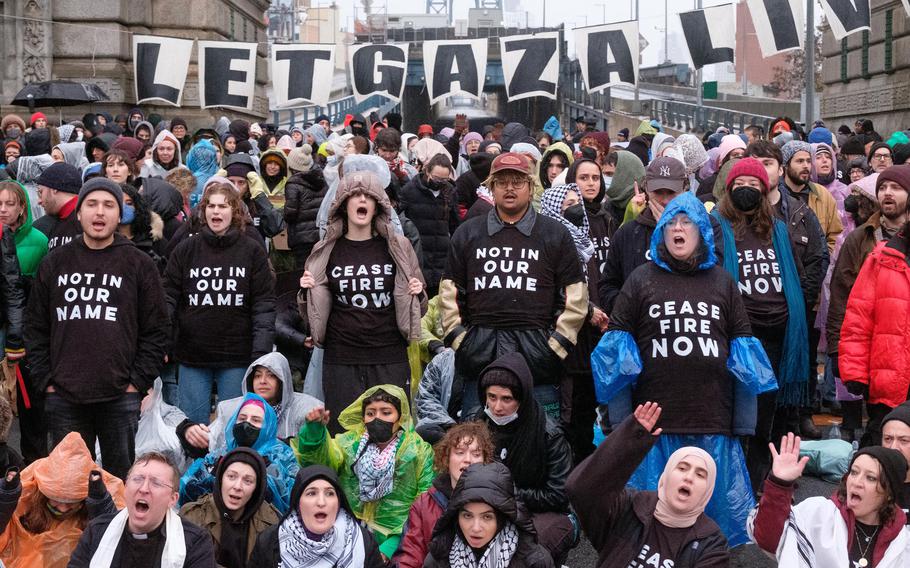 Pro-Palestine protesters demanding a Gaza ceasefire block the Manhattan Bridge in both directions between Manhattan and Brooklyn in New York City on Sunday, Nov. 26, 2023.