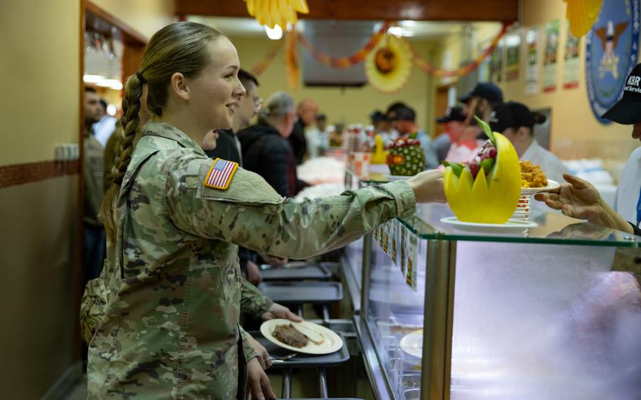 Multinational forces and distinguished guests celebrate Thanksgiving with a feast