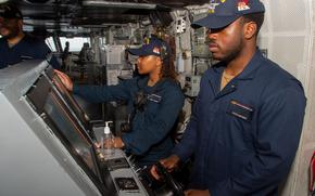 240528-N-UF592-1051 PHILIPPINE SEA (May 28, 2024) Seaman Kevon Grayson, from Titusville, Florida, steers the ship at the helm in the pilot house aboard the U.S. Navy’s only forward-deployed aircraft carrier, USS Ronald Reagan (CVN 76), in the Philippine Sea, May 28. Ronald Reagan, the flagship of Carrier Strike Group 5, provides a combat-ready force that protects and defends the United States, and supports alliances, partnerships and collective maritime interests in the Indo-Pacific region. (U.S. Navy photo by Mass Communication Specialist 3rd Class Eric Stanton)